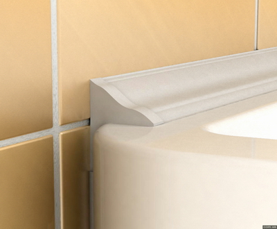 Ceramic baseboard masks the joint of the bath with the wall