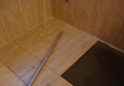 Laying tiles on a wooden floor is real!