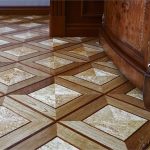 Art laminate with imitation of parquet and stone