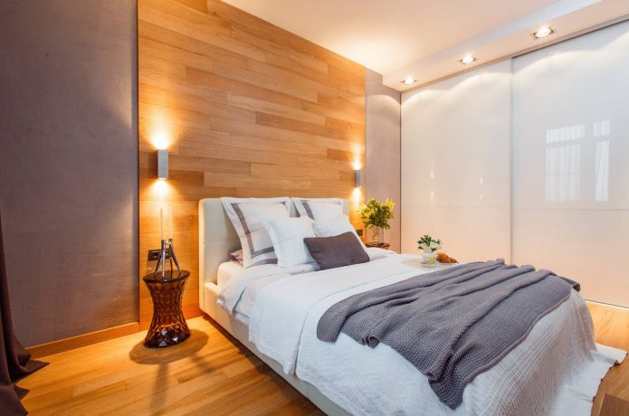 Zoning the wall with a laminate in the bedroom