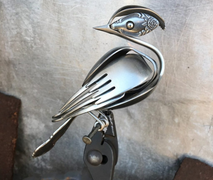 Figurine made of forks and spoons