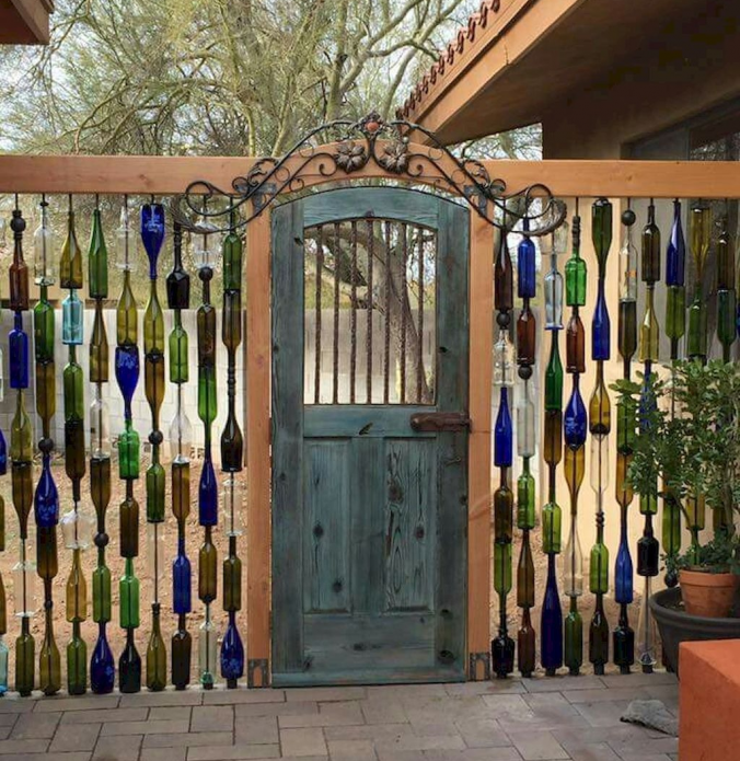Unusual fence of colored bottles