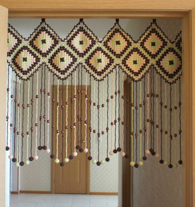 Knitted curtain on the doorway