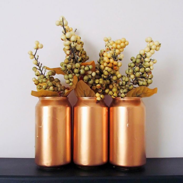 Flower arrangement in tin vases