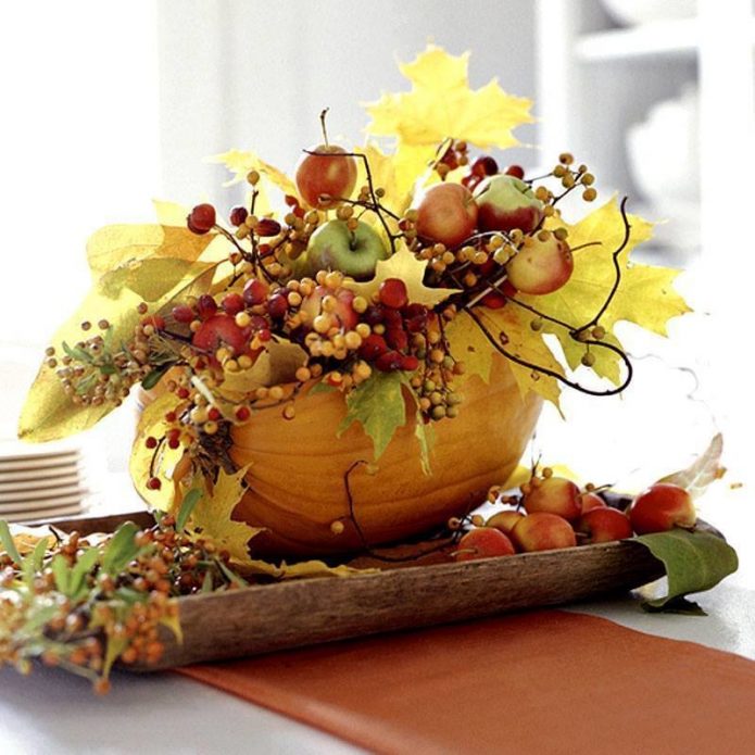 Autumn composition in a vase of pumpkins