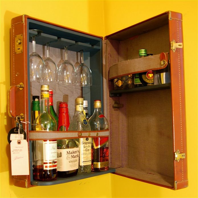 Hanging minibar from an old suitcase